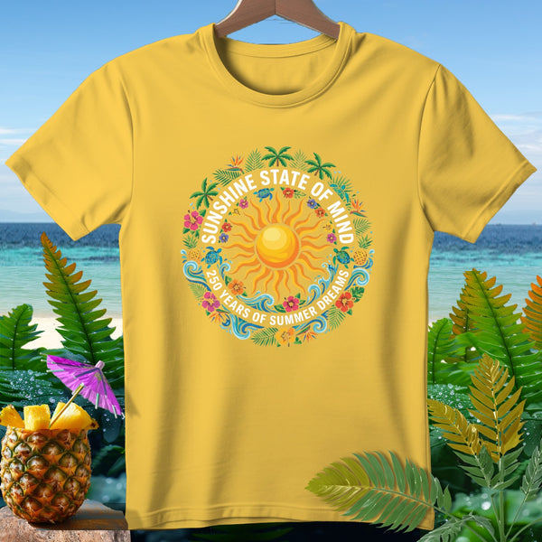 Yellow t-shirt with a circular graphic featuring a sun, sea turtles, and text "Sunshine State of Mind".
