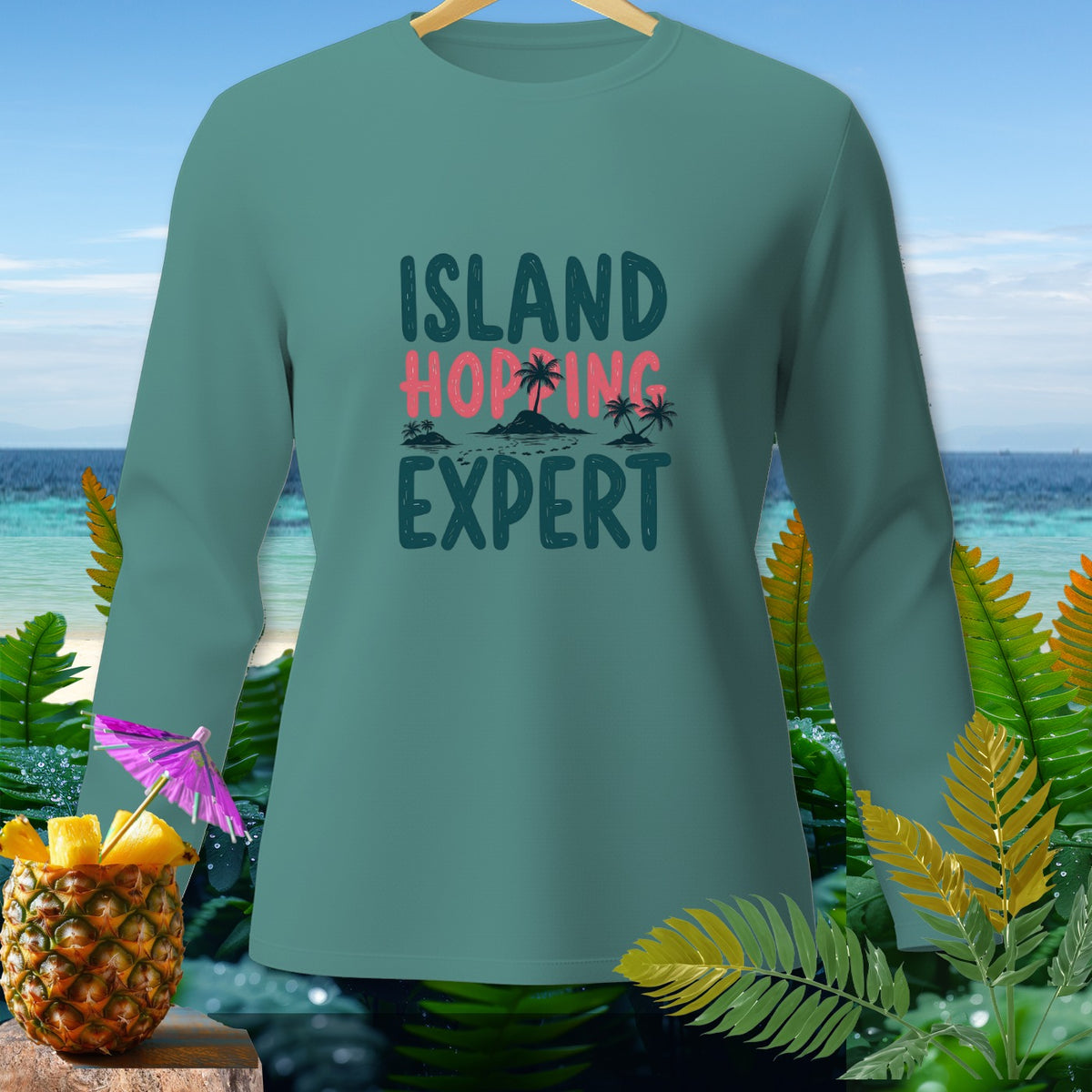 Teal long-sleeve shirt with "Island Hopping Expert" text and tropical graphics.