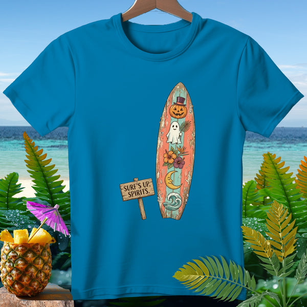 Blue t-shirt with a surfboard graphic featuring a ghost, pumpkin, moon, and the text "Surf's Up, Spirits."