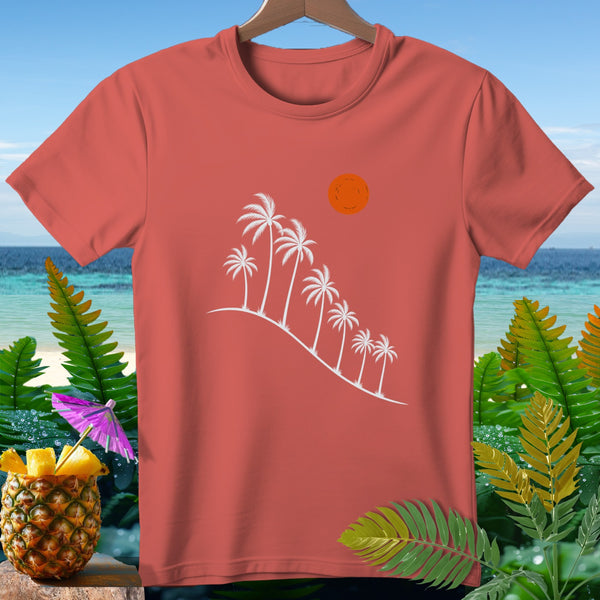 Coral t-shirt with white palm trees and sun graphic against beach backdrop.