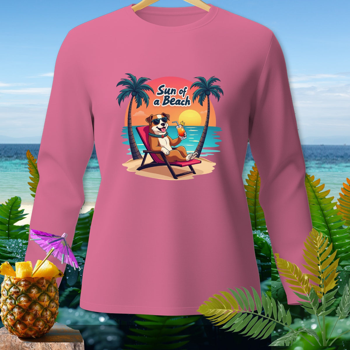Pink long-sleeve shirt with a cartoon dog on a beach chair and text "Sun of a Beach".