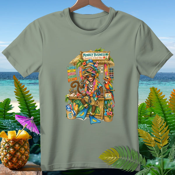 Monkey wearing sunglasses and leis at a "Monkey Business" souvenir stand.
