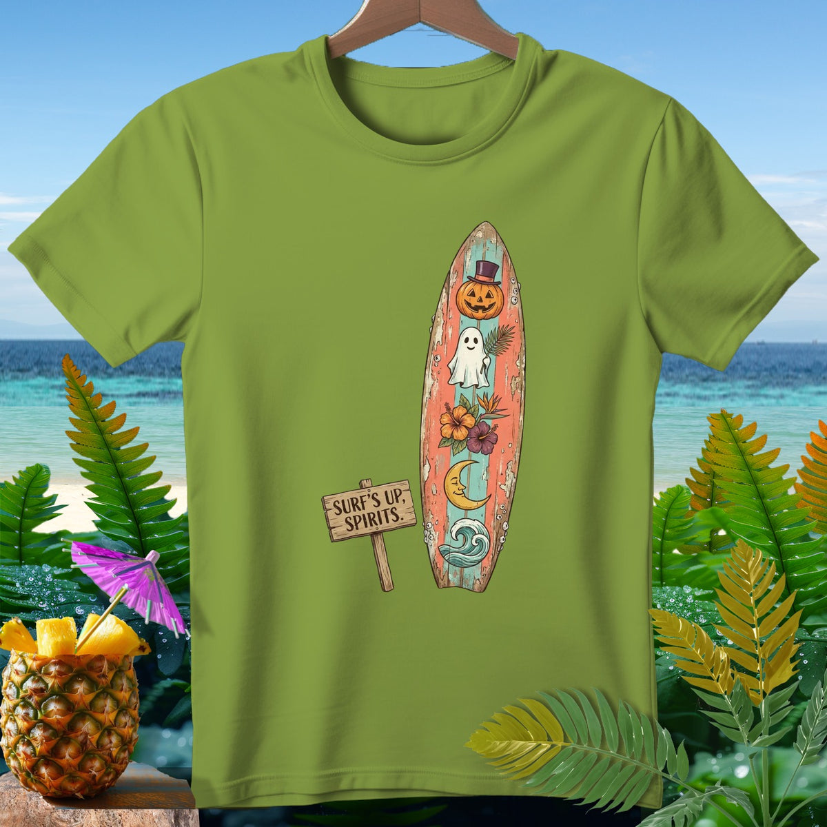 Green t-shirt with a surfboard design featuring a ghost, pumpkin, and tropical flowers.