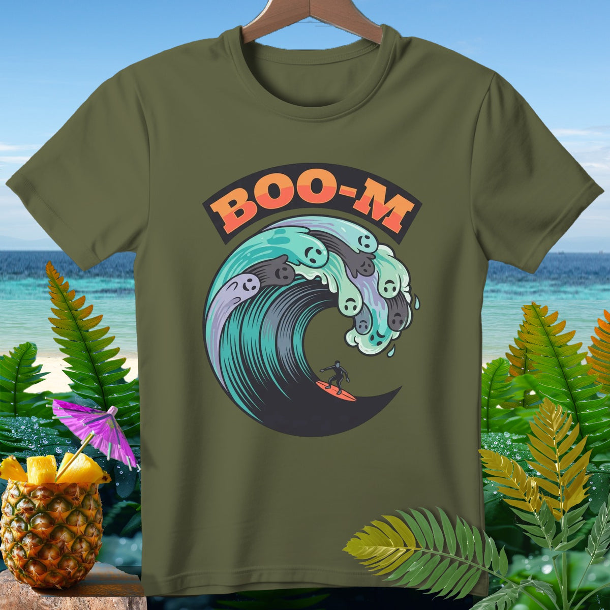 Green t-shirt with "BOO-M" and surfer on a wave with ghost faces.