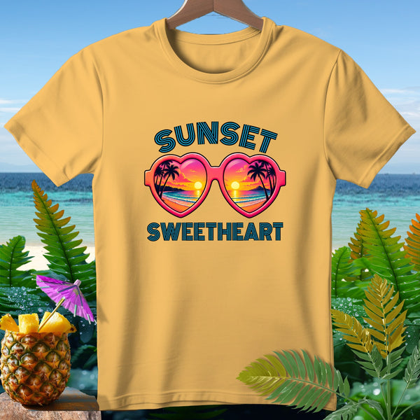 Yellow t-shirt with "Sunset Sweetheart" text and heart-shaped sunglasses.