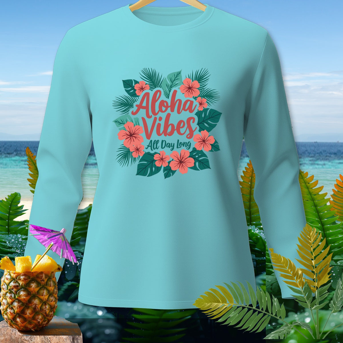 Light blue long-sleeve shirt with "Aloha Vibes All Day Long" text and floral design.