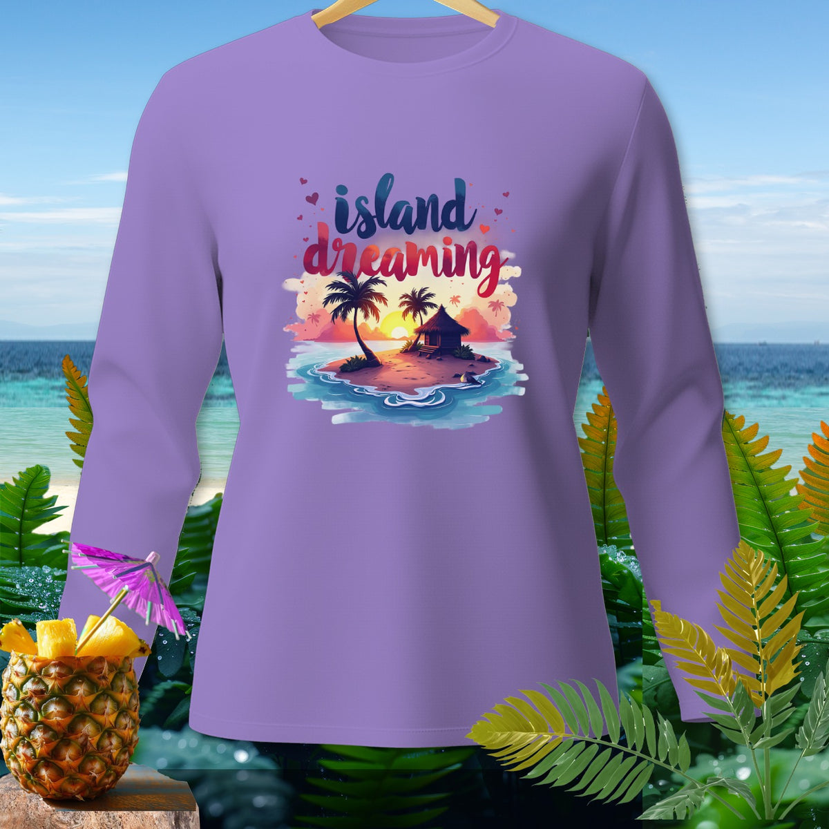 Purple long-sleeve shirt with "Island Dreaming" text and tropical island graphic.