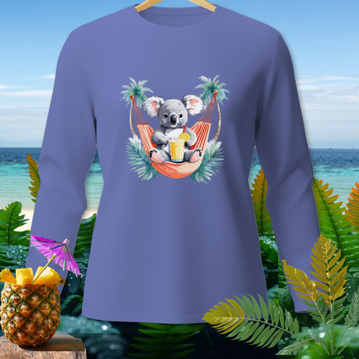 Purple long-sleeve shirt with a graphic of a koala relaxing in a hammock with a drink.