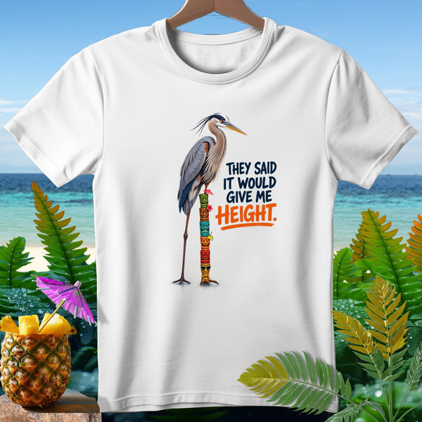 Great blue heron standing on totem poles with text "THEY SAID IT WOULD GIVE ME HEIGHT."