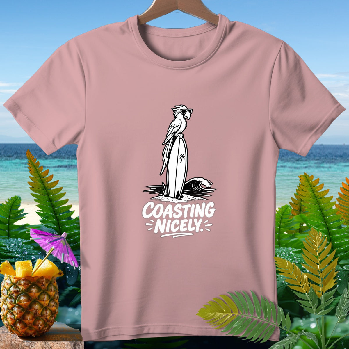 Pink t-shirt with a graphic of a parrot on a surfboard and the text "COASTING NICELY".