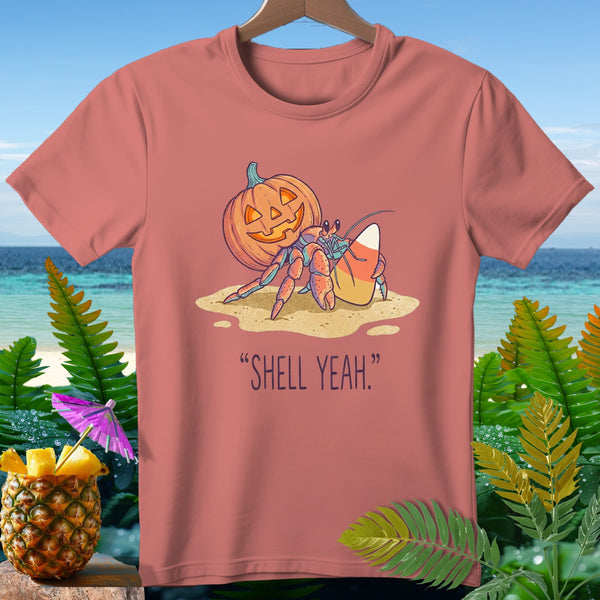 Hermit crab with pumpkin and candy corn, text "SHELL YEAH."