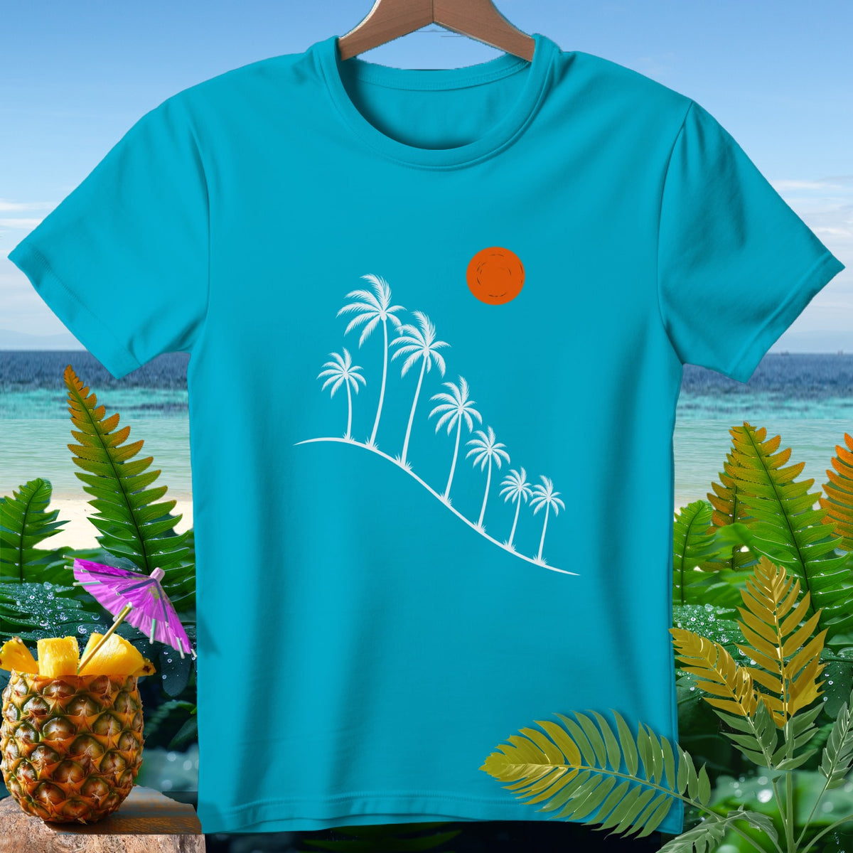 Turquoise t-shirt with white palm trees, orange sun, and tropical beach background.