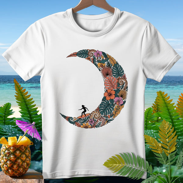 White t-shirt with crescent moon design filled with tropical foliage and a surfer.