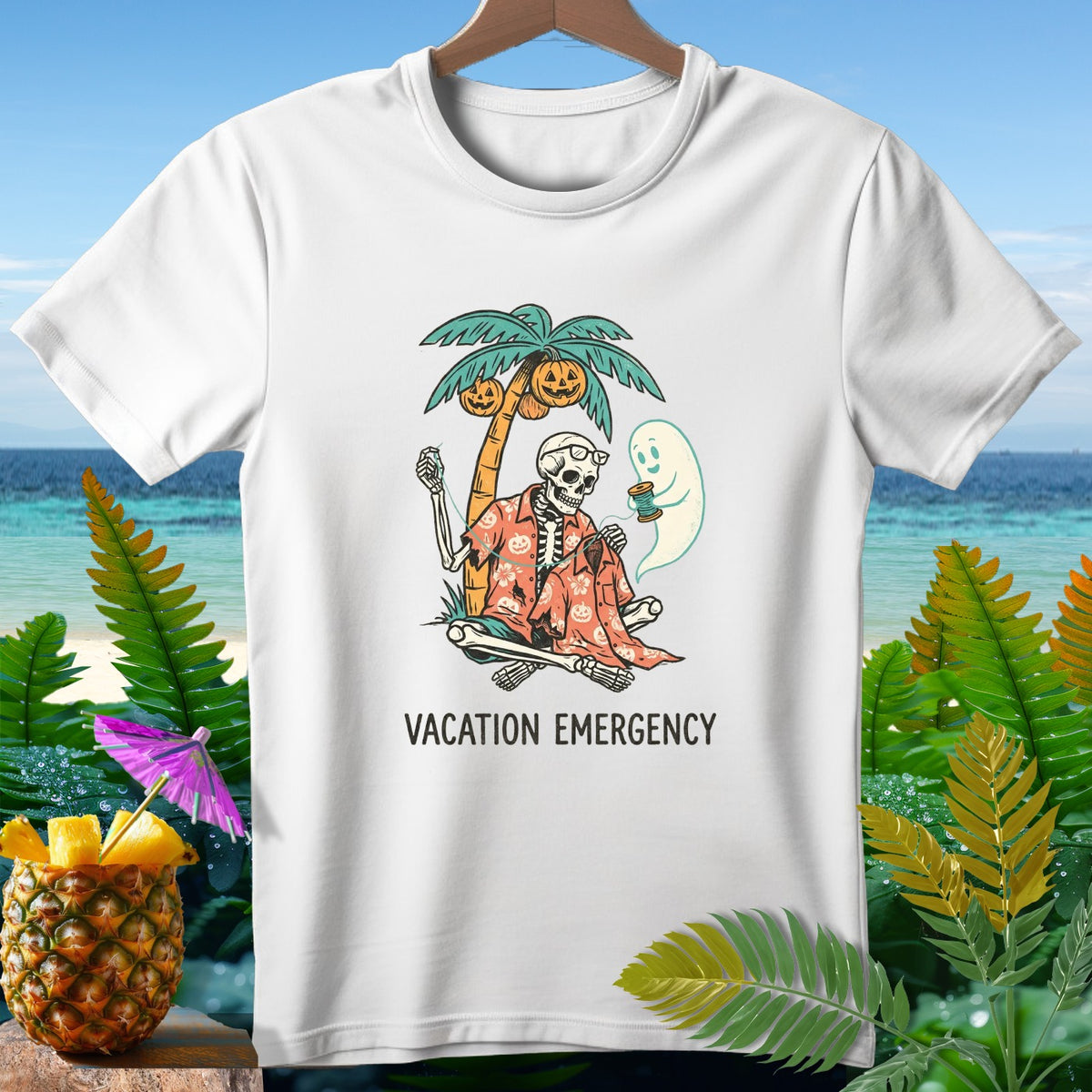 Skeleton sewing with a ghost under a palm tree with pumpkins, text Vacation Emergency.
