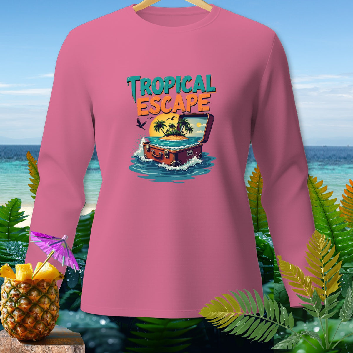 Pink long-sleeve shirt with "Tropical Escape" text and suitcase graphic.