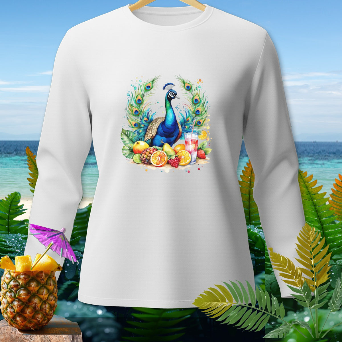 White long-sleeve shirt with peacock and fruit design and beach background.