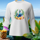 White long-sleeve shirt with peacock and fruit design and beach background.