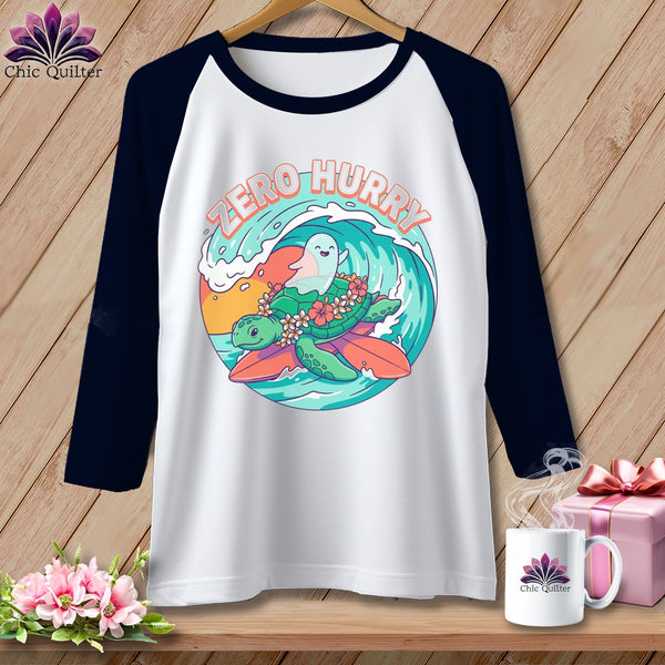 White raglan shirt with a graphic of a turtle and ghost surfing on a wave.
