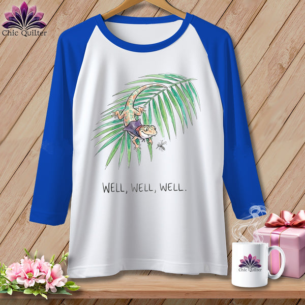 White baseball tee with a gecko, palm leaf, and "WELL, WELL, WELL" text.
