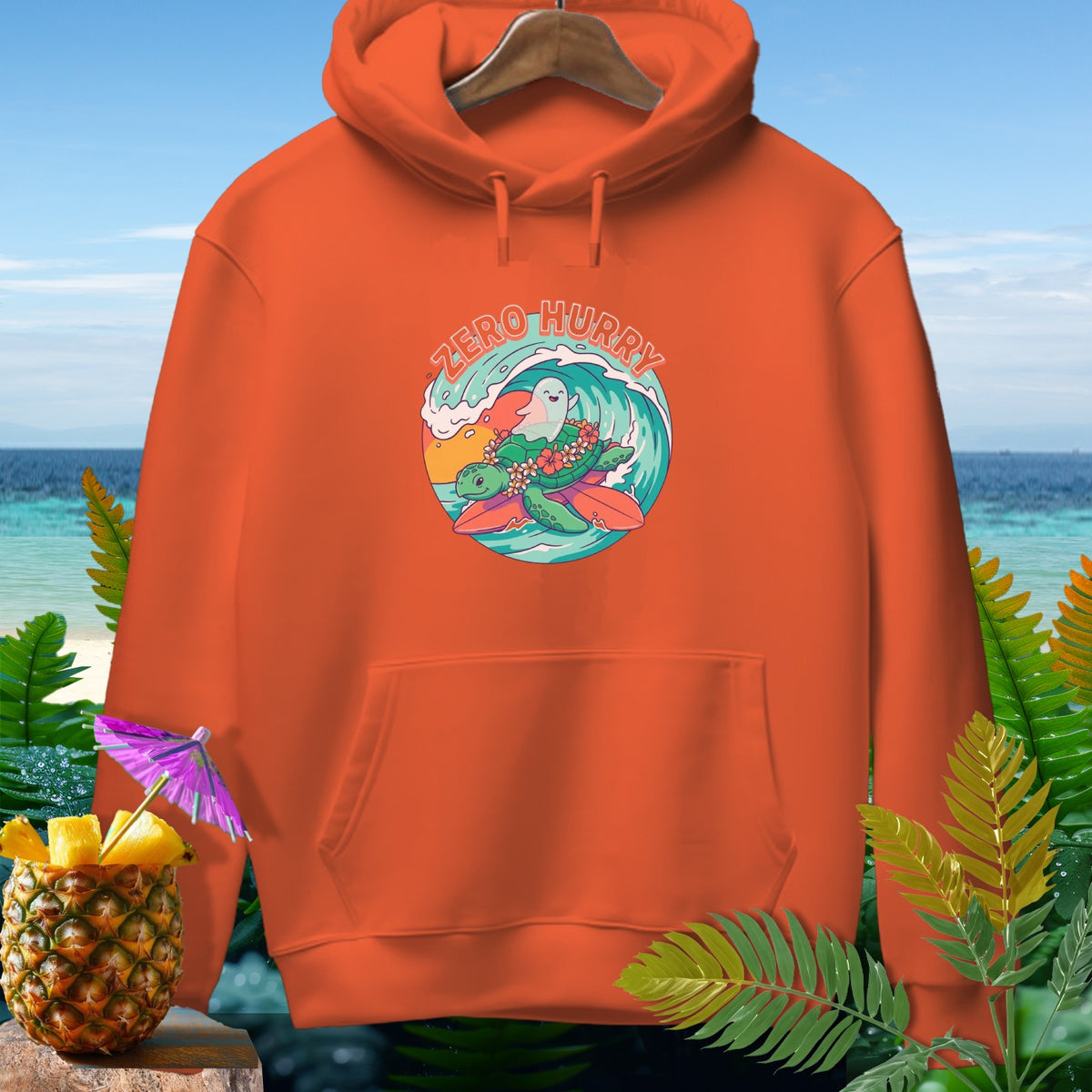 Orange hoodie with "Zero Hurry" text and cartoon turtle surfing with a ghost.