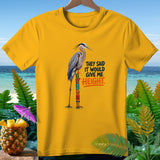 Yellow t-shirt with a heron on a tiki pole, text 