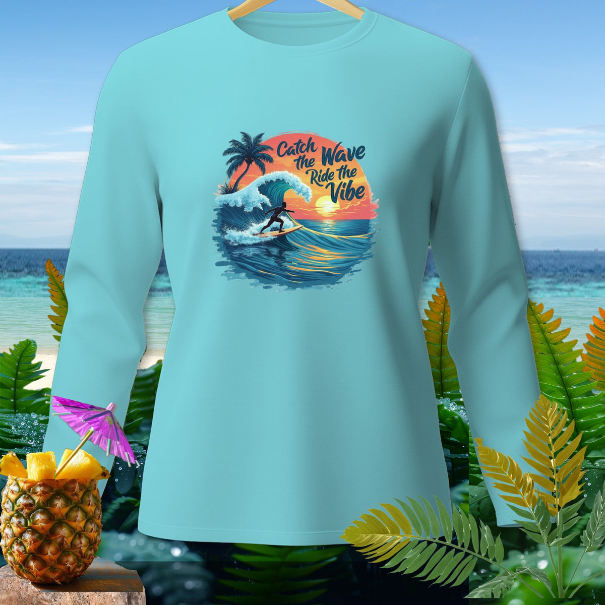 Light blue long-sleeve shirt with "Catch the Wave Ride the Vibe" surf graphic.