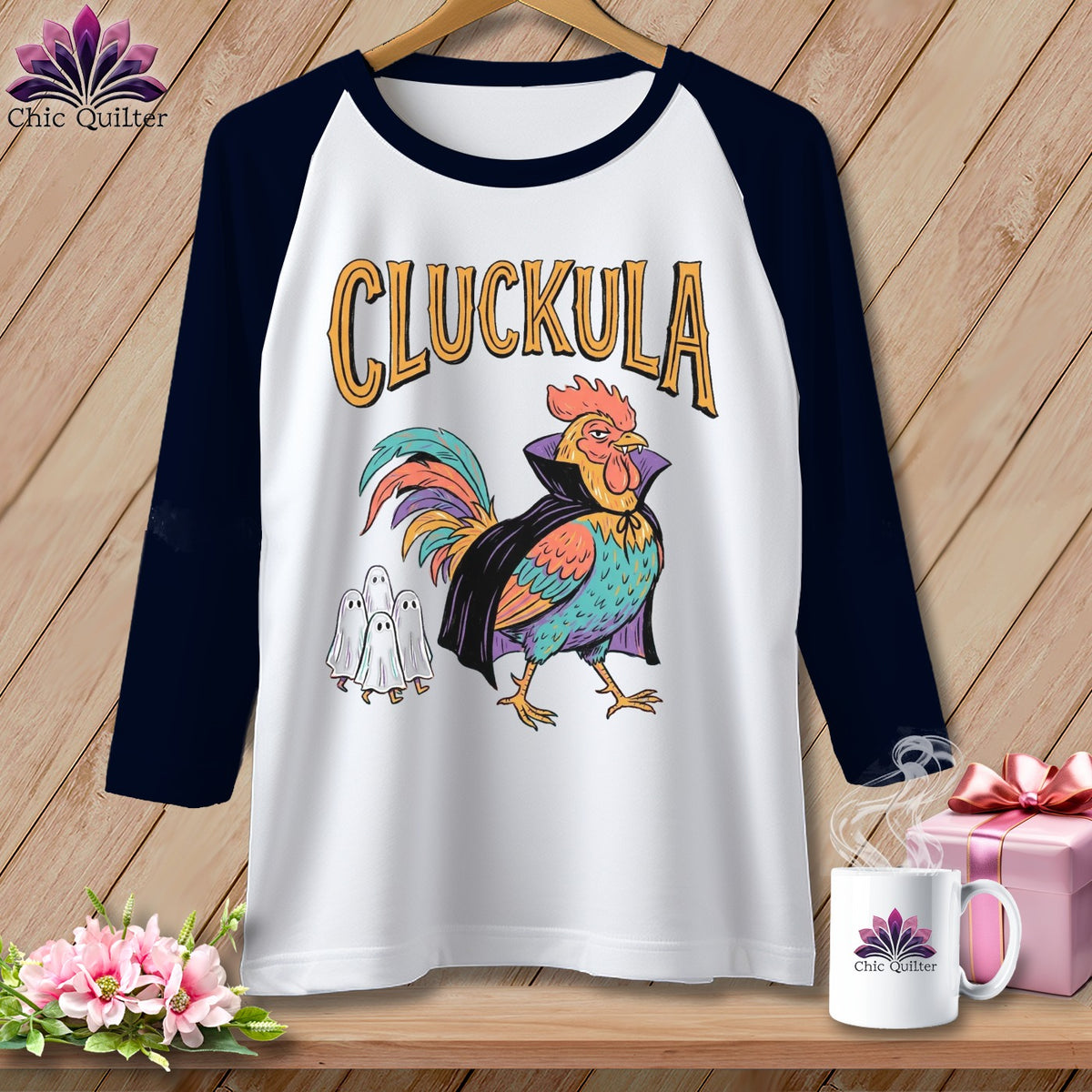 Baseball tee with a "Cluckula" rooster and ghosts design.