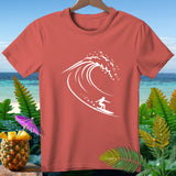 Coral t-shirt with white surfer graphic against a beach background.