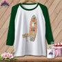 Green sleeve raglan shirt with surfboard design, "Surf's Up, Spirits."