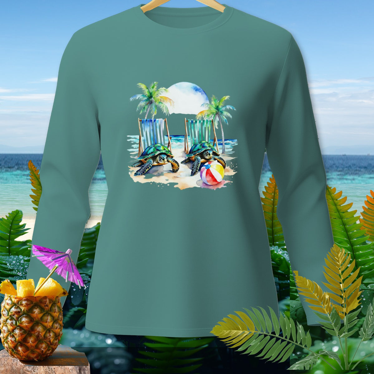 Long sleeve shirt with two sea turtles, beach chairs, and beach ball graphic.
