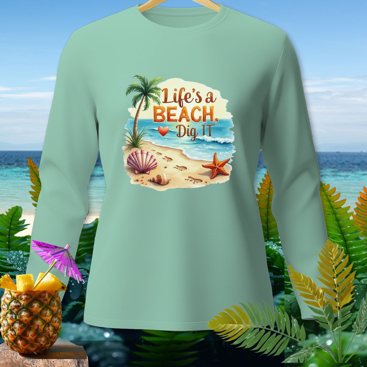 Mint long sleeve shirt with beach graphic and text "Life's a BEACH, Dig IT."