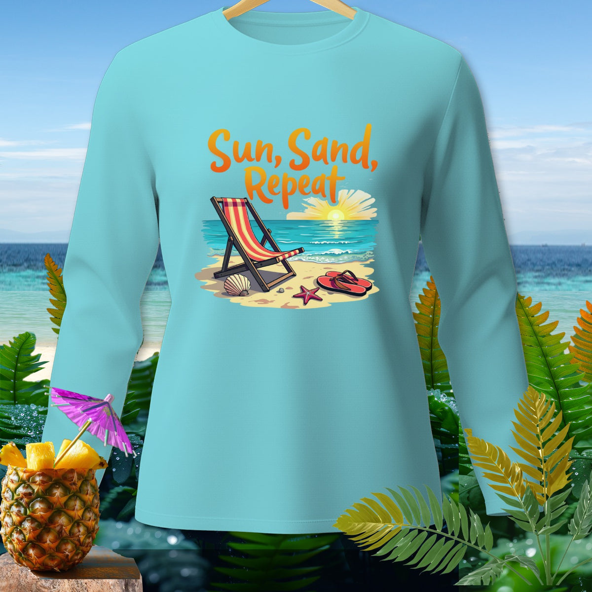 Light blue long sleeve shirt with "Sun, Sand, Repeat" beach graphic.