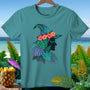 Teal t-shirt with a tropical witch hat design featuring silhouette profile and leaves.