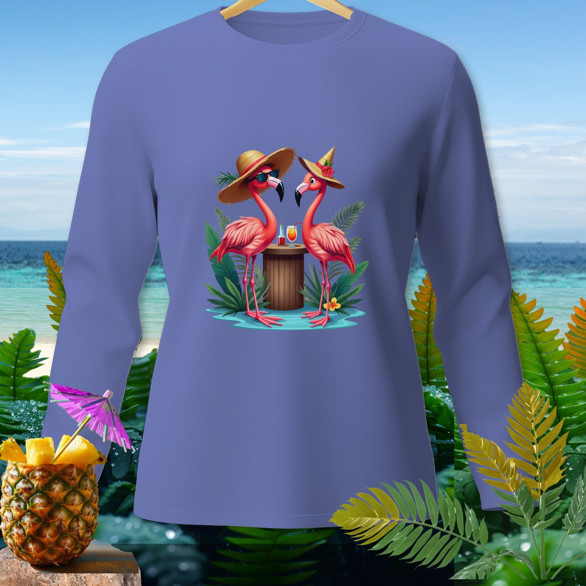 Two flamingos wearing hats and sunglasses with drinks on a tropical beach.
