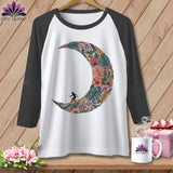 White baseball tee with a floral crescent moon design and surfer silhouette.
