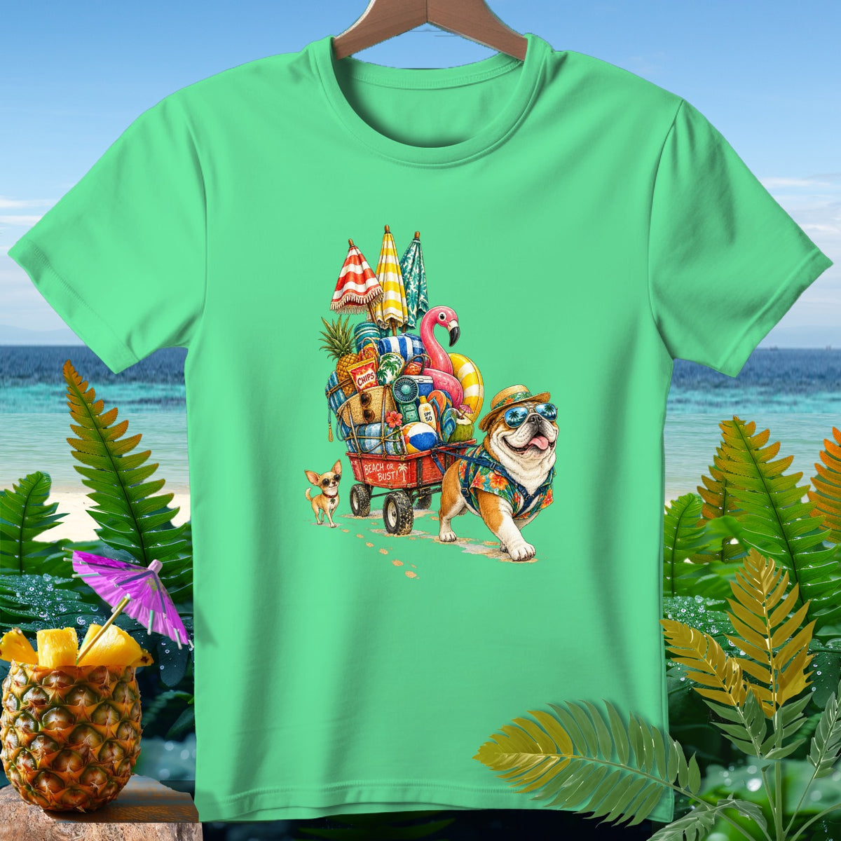Bulldog and chihuahua pulling a wagon full of beach items, text "Beach or Bust!".