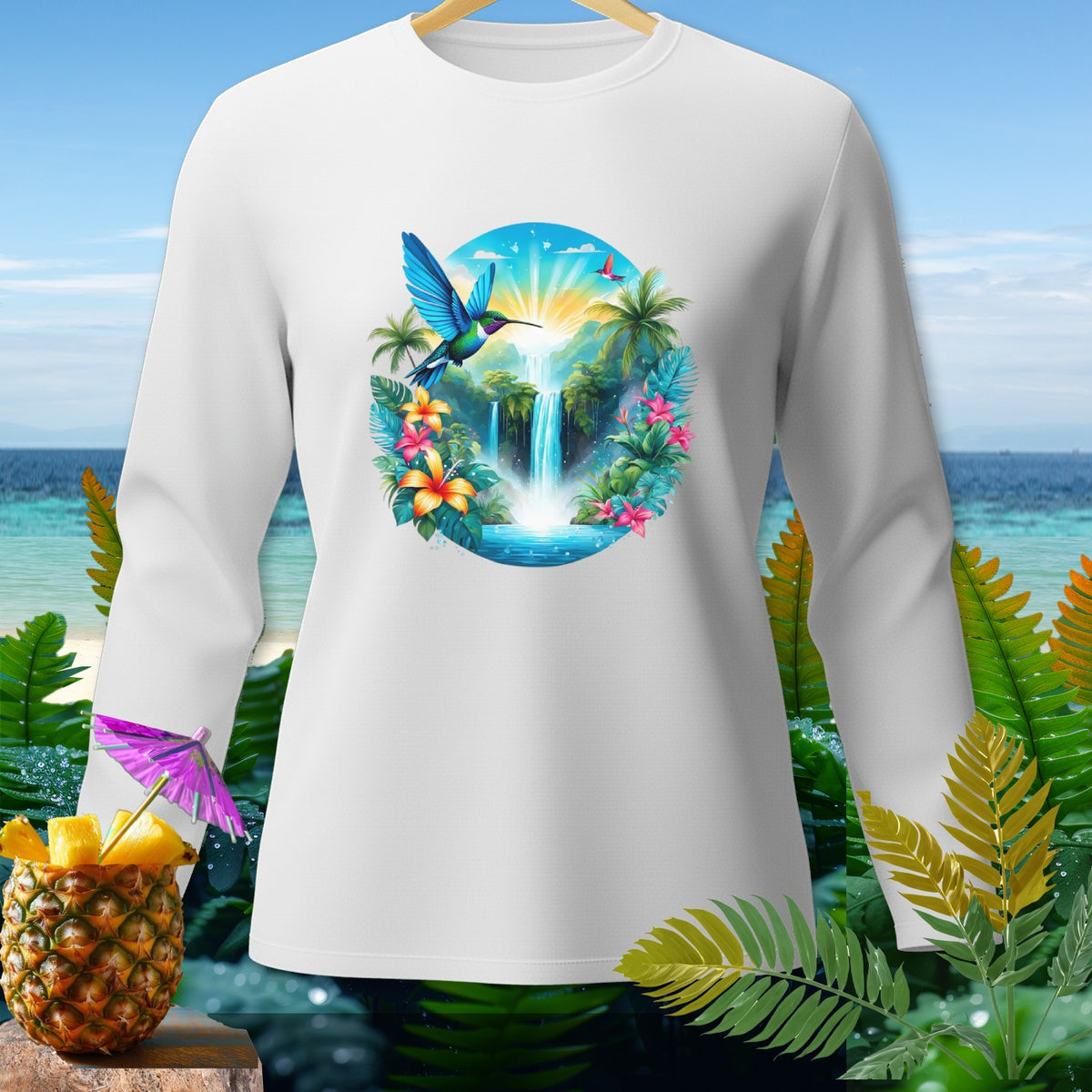White long-sleeve shirt with a tropical waterfall and hummingbird graphic.