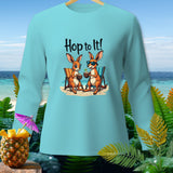Light blue long-sleeve shirt with two kangaroos relaxing on a beach, 