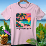 Pink t-shirt with a beach sunset graphic and text 