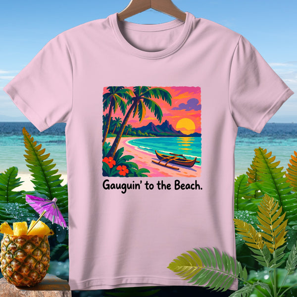 Pink t-shirt with a beach sunset graphic and text "Gauguin' to the Beach."