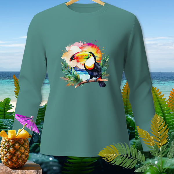 Teal long sleeve shirt with toucan on branch at sunset, tropical background.