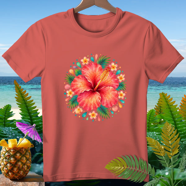 Coral t-shirt with a circular floral hibiscus design on a beach background.