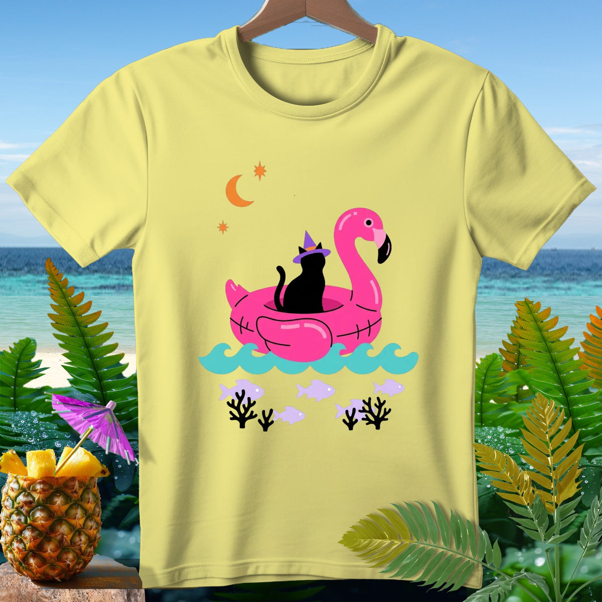 Black cat in witch hat on pink flamingo float with fish and moon design.