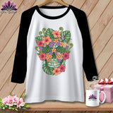 White raglan t-shirt with a floral skull design and black sleeves.