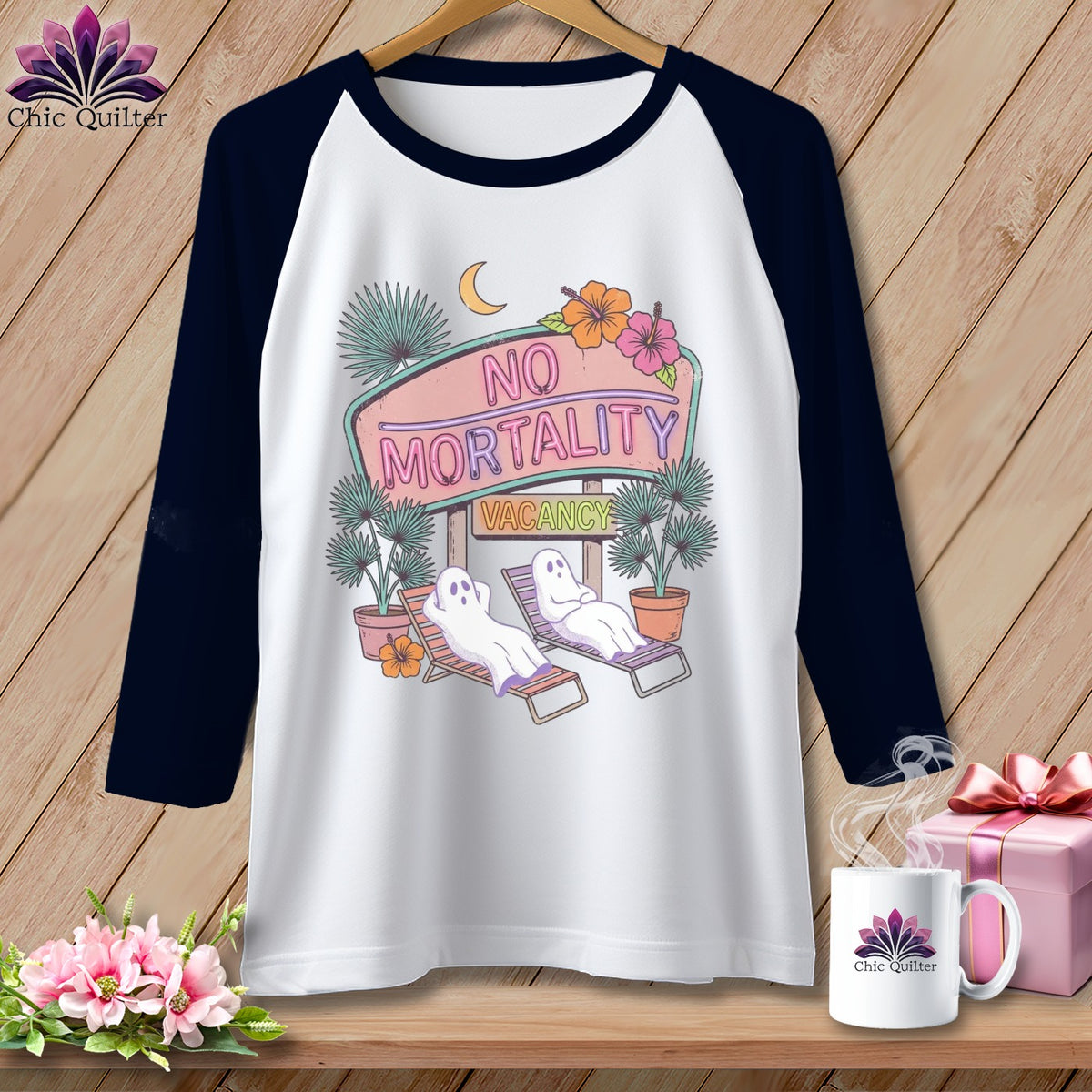 White baseball tee with graphic of ghosts on lounge chairs and "No Mortality Vacancy" sign.