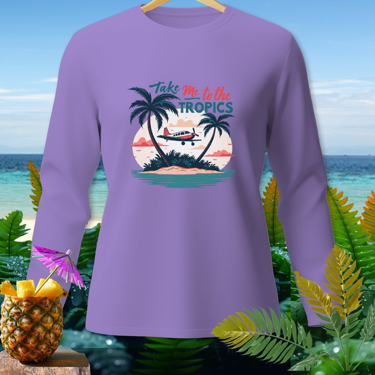 Purple long-sleeve shirt with "Take Me to the Tropics" text and tropical island graphic.