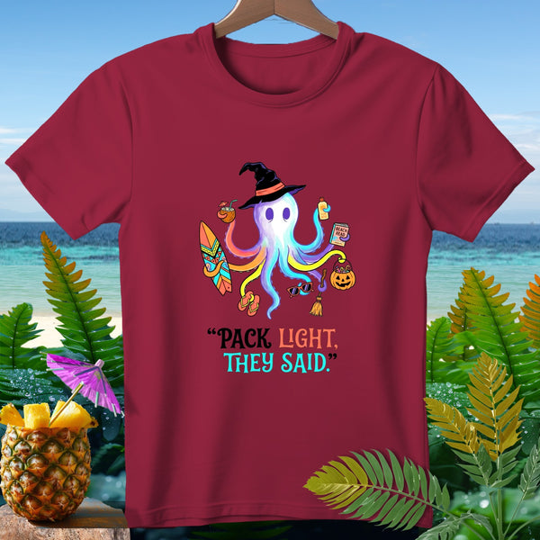 Maroon t-shirt with colorful octopus wearing a witch hat and beach items, text "PACK LIGHT, THEY SAID."