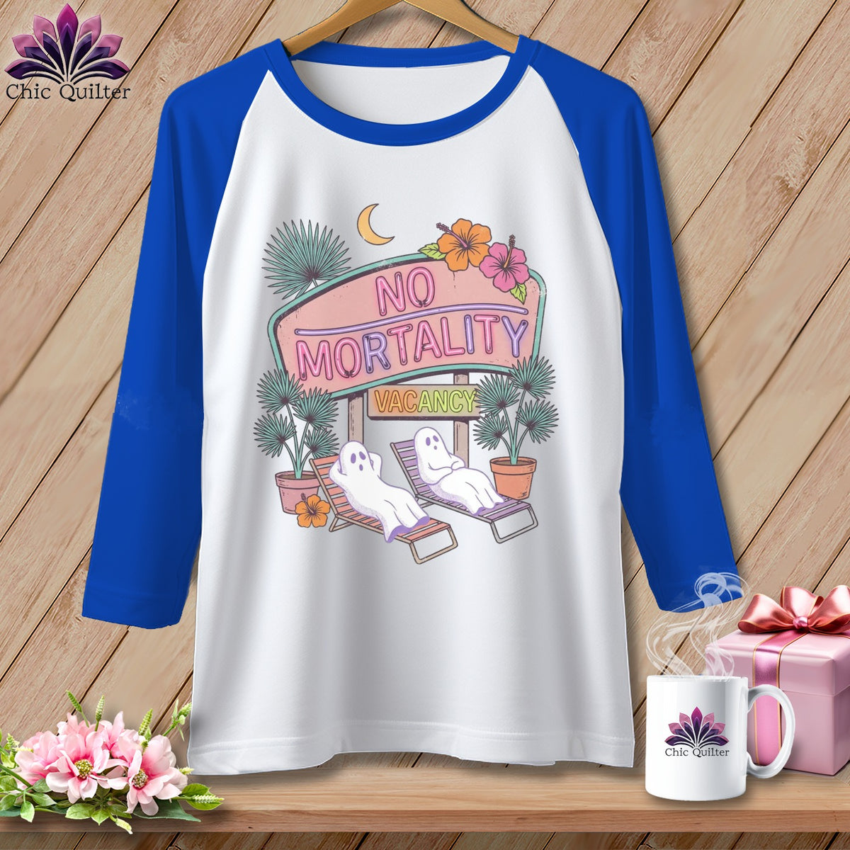 Raglan sleeve shirt with ghosts on lounge chairs under a neon "NO MORTALITY VACANCY" sign.