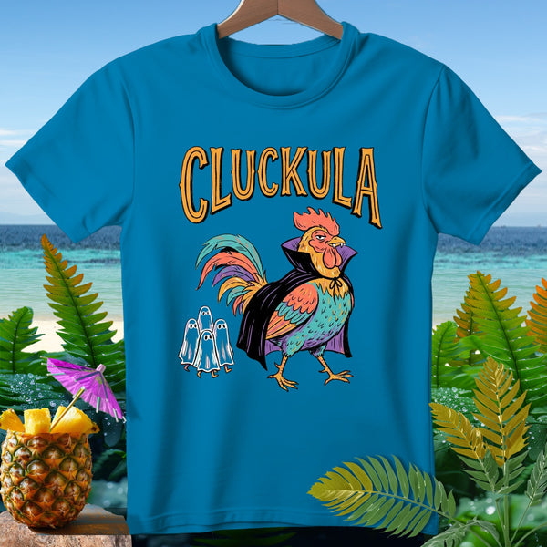 Blue t-shirt with "CLUCKULA" text, a rooster in a cape, and three ghosts.