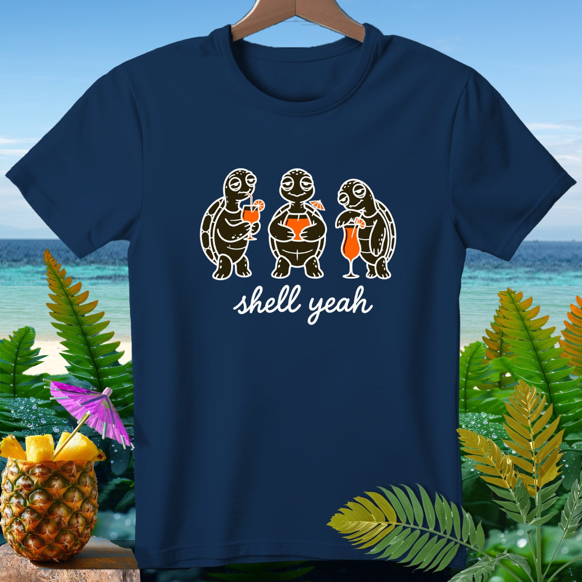 Three turtles with drinks and "shell yeah" text on a navy shirt.